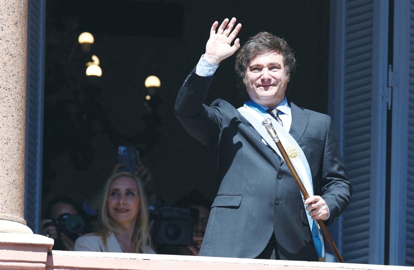  ARGENTINA’S PRESIDENT Javier Milei waves to supporters, as his sister Karina Milei looks on, after his swearing-in ceremony in Buenos Aires, earlier this month. (photo credit: AGUSTIN MARCARIAN/REUTERS)