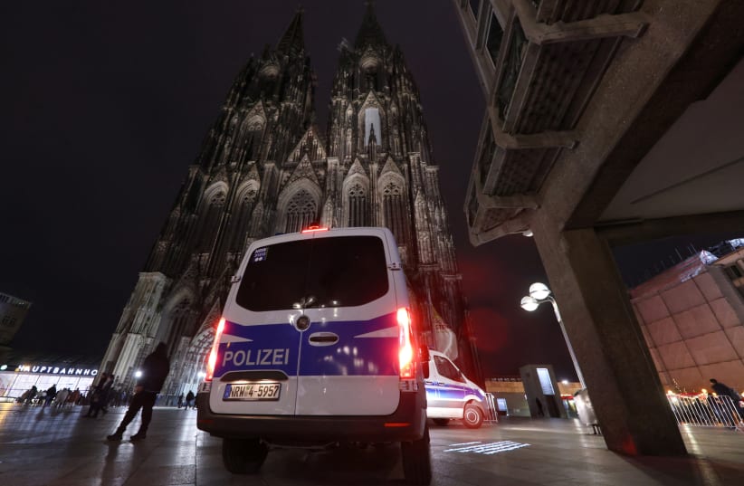  German police secures the cathedral in central Cologne, Germany, December 23, 2023. (photo credit: THILO SCHMUELGEN/REUTERS)
