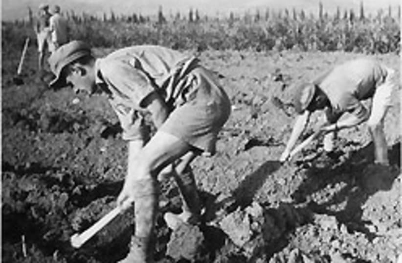 early kibbutz workers 88 248 (photo credit: Jerusalem Post Archives)