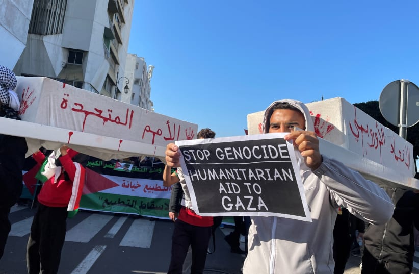  Protesters carry representations of caskets, at a demonstration calling for an end to Morocco's ties with Israel, amid the ongoing conflict between Israel and Palestinian Islamist group Hamas, in Rabat, Morocco December 24, 2023. (photo credit: REUTERS/Ahmed El Jechtimi)