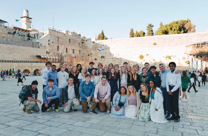  A DELEGATION brought to Israel by Passages visits the Western Wall.  (photo credit: PASSAGES)