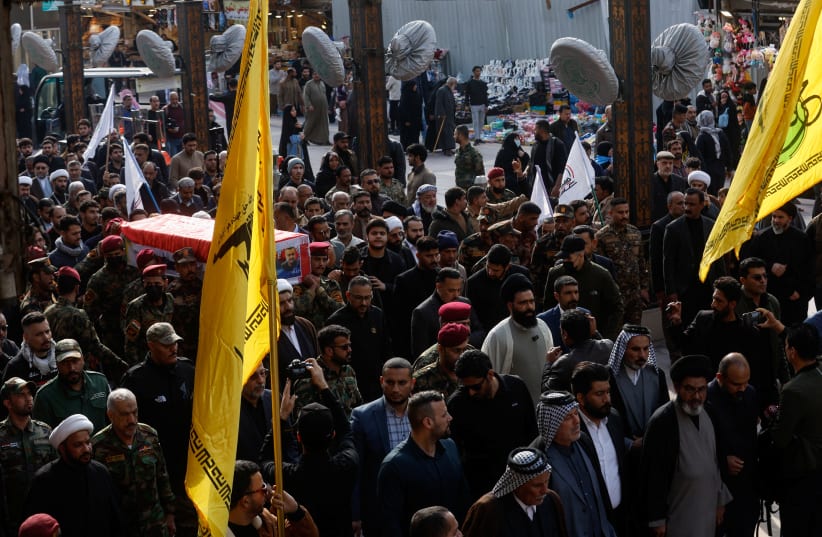  People carry the coffin of senior adviser for Iran's Revolutionary Guards, Sayyed Razi Mousavi, who was killed in an Israeli air strike outside the Syrian capital Damascus, during his funeral in Najaf, Iraq, December 27, 2023. (photo credit: REUTERS/ALAA AL-MARJANI)