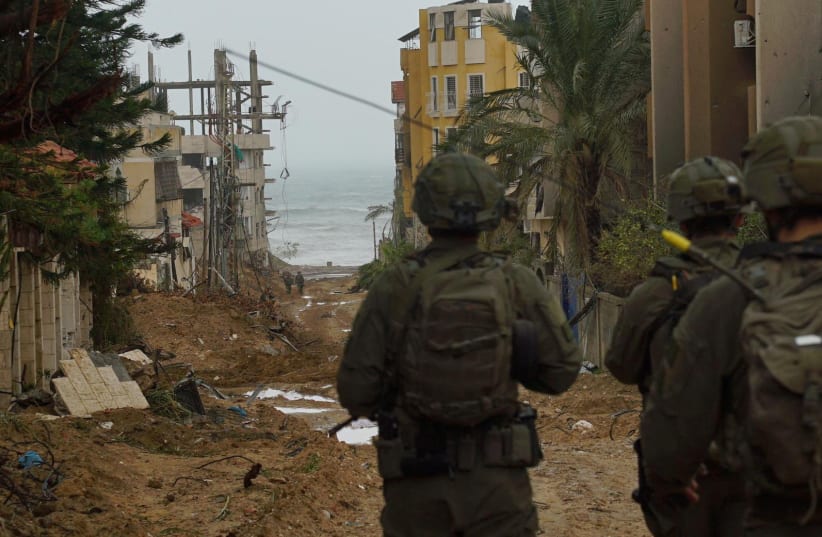  Israeli soldiers operate in the Gaza Strip, after a temporary truce expired between Israel and the Palestinian Islamist group Hamas, in this handout picture released on December 2, 2023.  (photo credit: Israel Defense Forces/Handout via REUTERS)