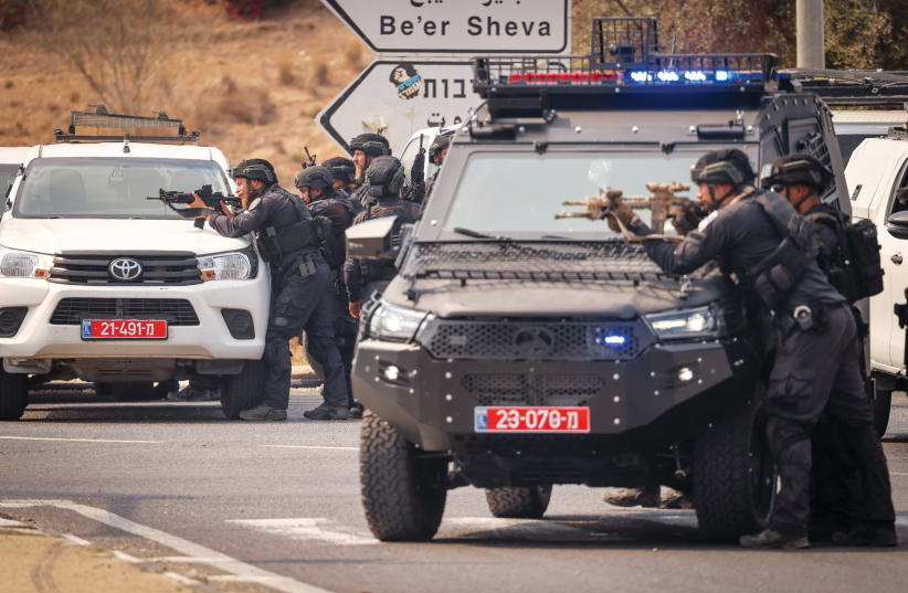  ISRAELI FORCES outside the entrance to the south of Sderot, with Hamas to the west, on October 8. (photo credit: Chaim Goldberg/Flash90)