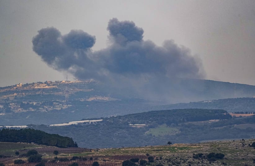  Smoke rises during an exchange of fire between the IDF and terrorists from the Hezbollah organization on the border between Israel and Lebanon, December 27, 2023.  (photo credit: AYAL MARGOLIN/FLASH90)