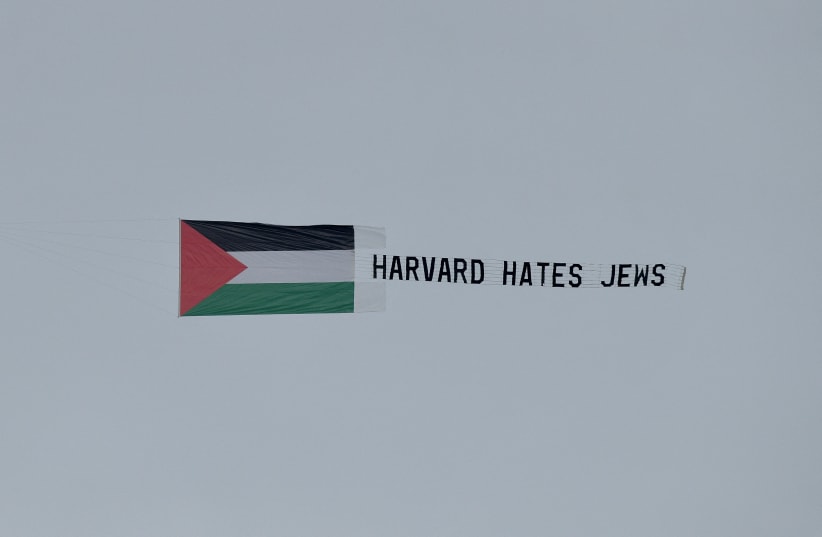  Students fly an aerial banner that reads "Harvard hates Jews" over the campus at Harvard University in Cambridge, Massachusetts, U.S., December 7, 2023. (photo credit: REUTERS/FAITH NINIVAGI)