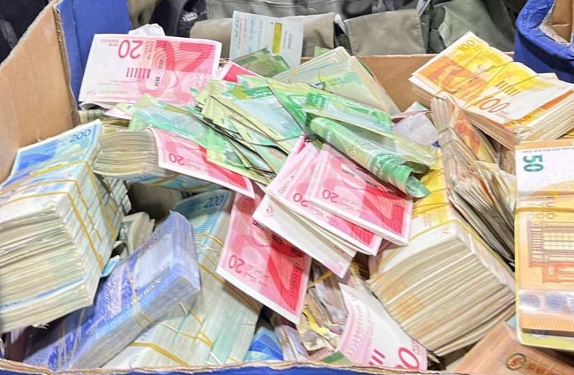  Cash seized overnight in the West Bank by Israeli security forces. December 26, 2023. (photo credit: IDF SPOKESPERSON'S UNIT)