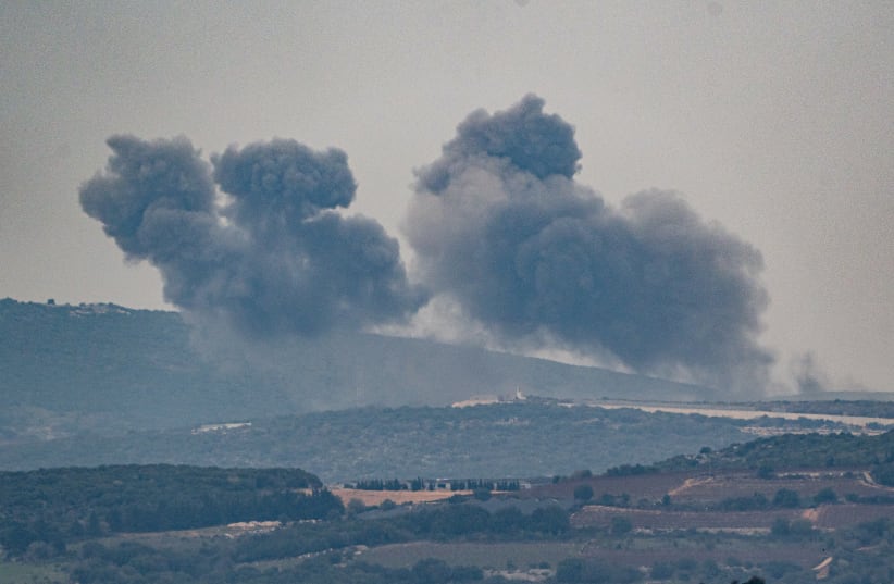 Smoke rises during an exchange of fire between the IDF and terrorists from the Hezbollah organization on the border between Israel and Lebanon, December 27, 2023.  (photo credit: AYAL MARGOLIN/FLASH90)