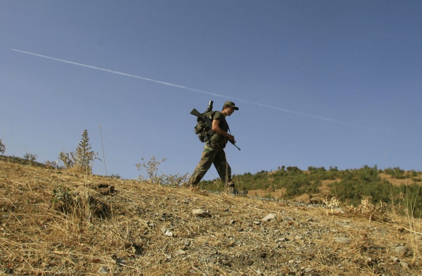  A Turkish soldier patrols in the southeastern Turkish province of Sirnak October 27, 2007. (photo credit: REUTERS/OSMAN ORSAL)