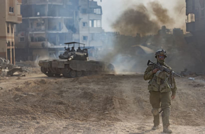  Israeli soldiers operating in Beit Lahia, in the northern Gaza Strip, December 28, 2023 (photo credit: YONATAN SINDEL/FLASH90)