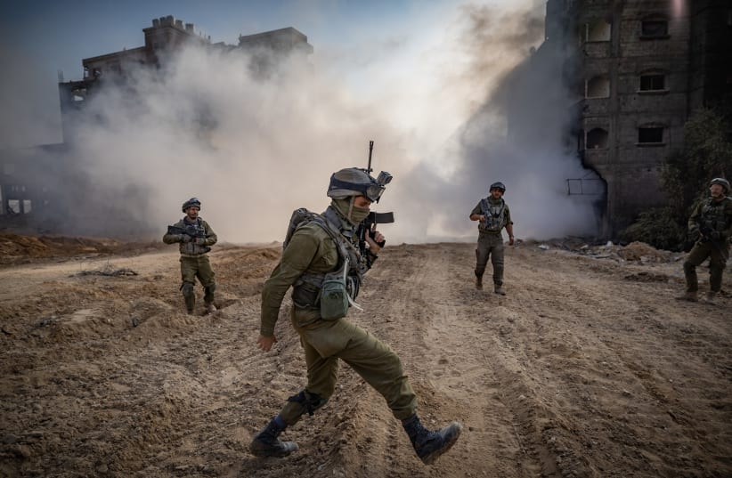  Israeli soldiers operating in Beit Lahia, in the northern Gaza Strip, December 28, 2023 (photo credit: YONATAN SINDEL/FLASH90)