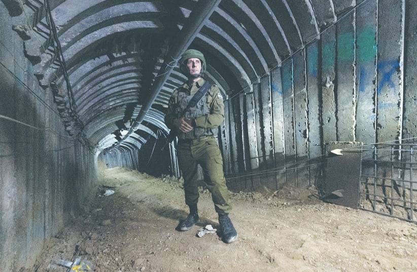  IDF SPOKESMAN Rear Admiral Daniel Hagari stands in a Hamas terror tunnel in the northern Gaza Strip, earlier this month. There must be a process that results in no terror tunnels, no terror leaders, no anti-Israel brainwashing in schools, no terror training, and no weapons, the writer asserts. (photo credit: AMIR COHEN/REUTERS)