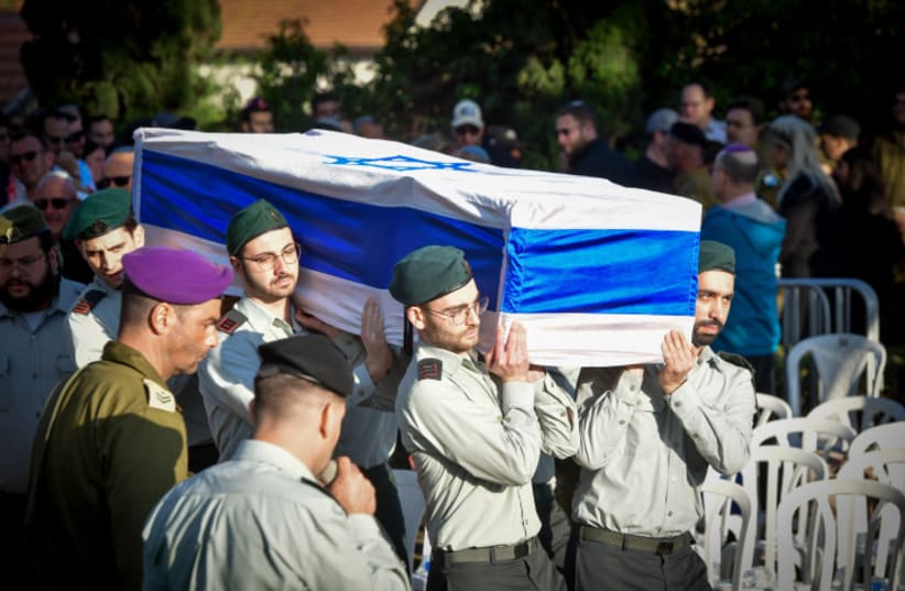  IDF funerals are becoming an almost-daily practice since Israel's ground invasion of Gaza began (photo credit: AVSHALOM SASSONI/FLASH90)