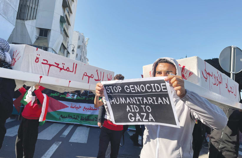  PROTESTERS call for an end to Morocco's ties with Israel, in Rabat, last week. Morocco's decision to keep its ambassador in Tel Aviv, despite the fact that the Israeli mission staff was evacuated from Rabat, is a significant statement, says the writer. (photo credit: REUTERS/Ahmed El Jechtimi)