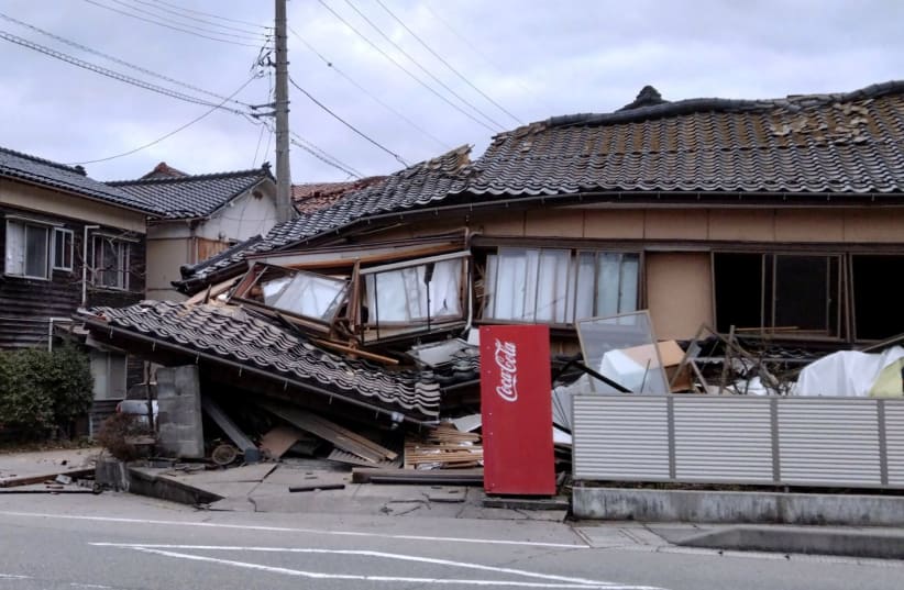  A collapsed house following an earthquake is seen in Wajima, Ishikawa prefecture, Japan January 1, 2024, in this photo released by Kyodo. (photo credit:  Kyodo via REUTERS)