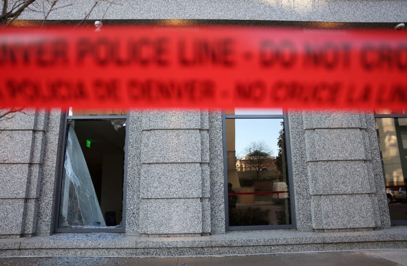 Police tape surrounds an area where a man broke into the Colorado Supreme Court building and barricaded himself inside overnight in Denver, Colorado, U.S., January 2, 2024. (photo credit: KEVIN MOHATT/REUTERS)