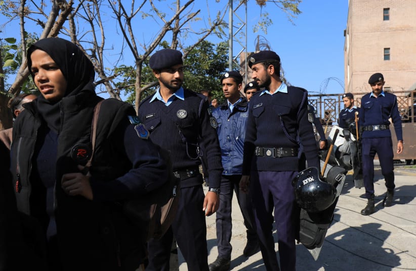 Police officers walk at the entrance of the district Judicial Complex in Islamabad, Pakistan November 28, 2023.  (photo credit: REUTERS/FAYAZ AZIZ)