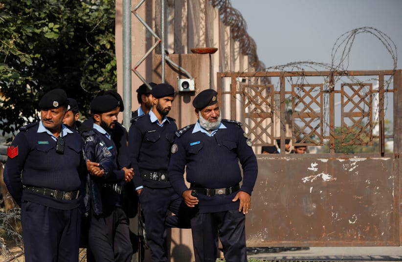  Police officers stand at the entrance of the district Judicial Complex in Islamabad, Pakistan November 28, 2023.  (photo credit: REUTERS/FAYAZ AZIZ)