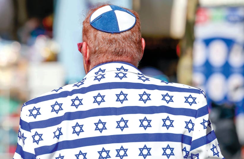  Jewish or Israeli? A man wearing a jacket decorated with the Star of David. (photo credit: MARC ISRAEL SELLEM)