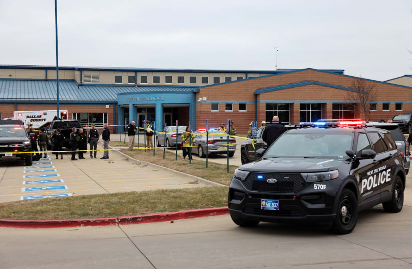  Law enforcement officers work at the scene of a shooting at Perry High School in Perry, Iowa, US, January 4, 2024 (photo credit: REUTERS/SCOTT MORGAN)