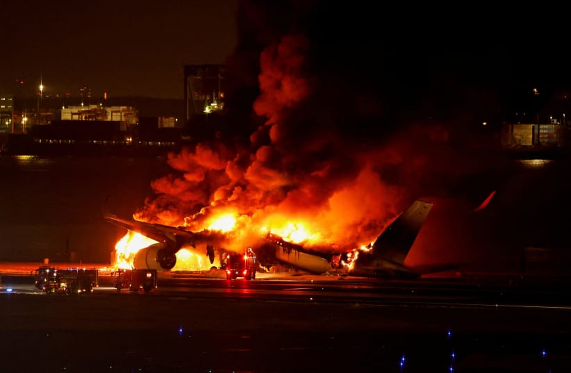  Japan Airlines' A350 airplane is on fire at Haneda international airport in Tokyo, Japan January 2, 2024. (photo credit: REUTERS/Issei Kato/File Photo)