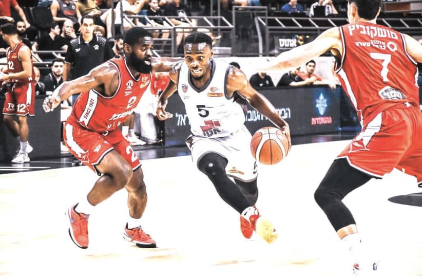 IRONI KIRYAT ATA point guard James Batemon (with ball) has been a crucial component of the club’s strong 5-2 start to the Israel Premier League season. (photo credit: YEHUDA HALICKMAN)