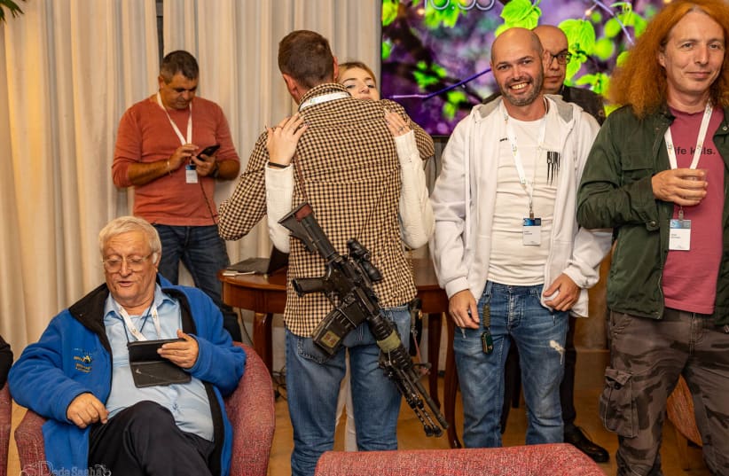  Israeli military reservists were among the 150 people with roots in the former Soviet Union who gathered on Dec. 21, 2023, for an evening of lectures, music and solidarity with Israel.  (photo credit: Alexander Khanin via JTA)
