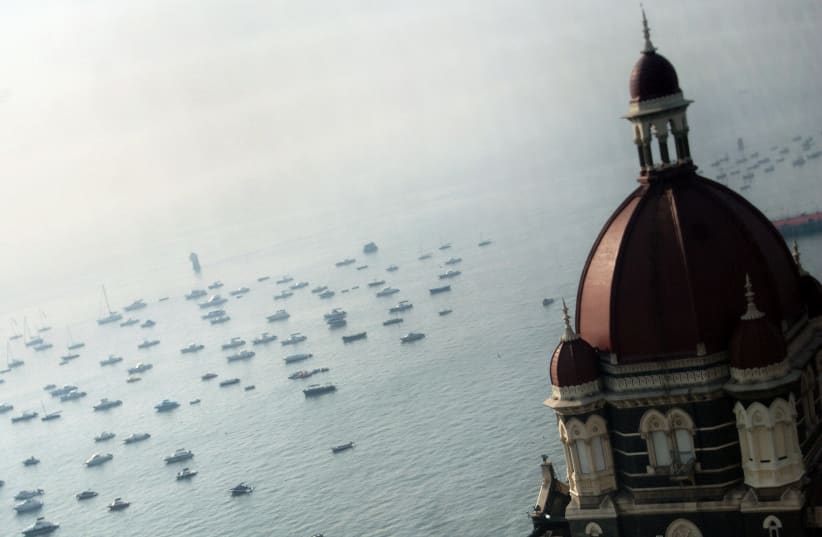  The domes of the Taj Mahal hotel are seen in front of the Arabian Sea in Mumbai December 22, 2008. (photo credit: REUTERS/Arko Datta)