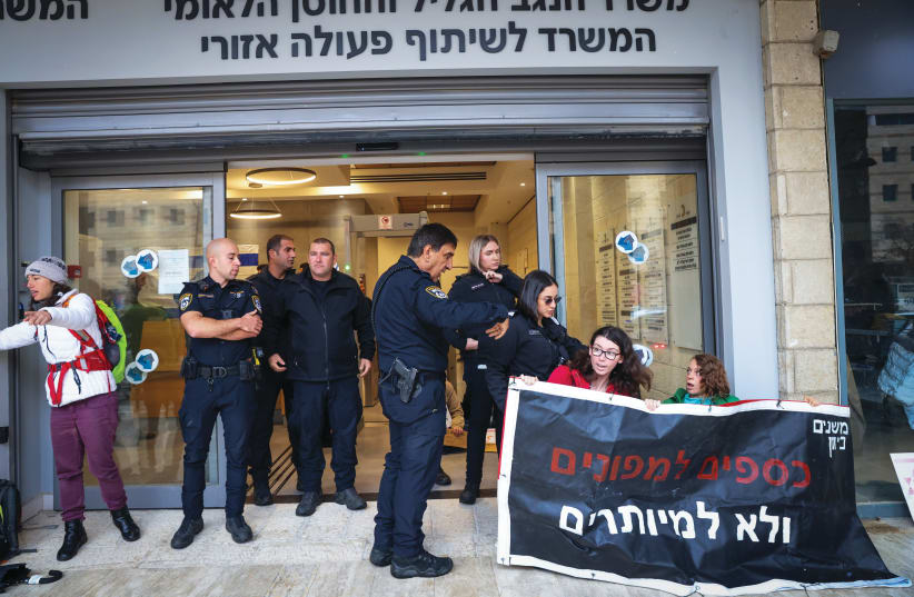  PROTESTING UNNECESSARY government offices outside the Development of the Negev and Galilee and National Resilience Ministry in Jerusalem, on December 24, 2023. (photo credit: YOSSI ZAMIR/FLASH90)