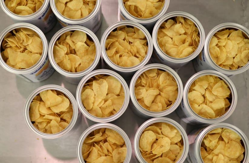 Cans of potatoes are pictured inside Bonilla a la Vista factory in Arteixo, near Coruna, Spain February 18, 2020. (photo credit: NACHO DOCE/REUTERS)