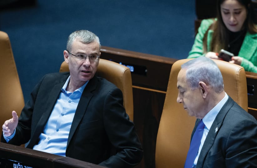  JUSTICE MINISTER Yariv Levin speaks with Prime Minister Benjamin Netanyahu in the Knesset plenum last month. In its decision, the High Court essentially dissolves the Knesset, irrespective of the individuals occupying its seats, the writer argues.  (photo credit: YONATAN SINDEL/FLASH90)