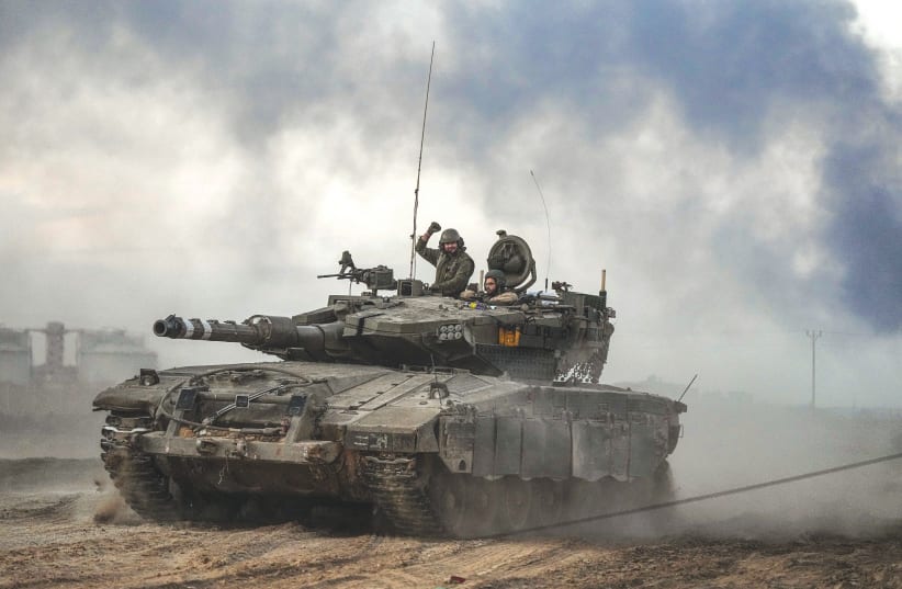  AN IDF tank is on the move near the border with the Gaza Strip, last week. Our soldiers will be the individual voices and the collective impetus for instilling a renewed awareness and spirit into our country, the writer asserts.  (photo credit: FLASH90)