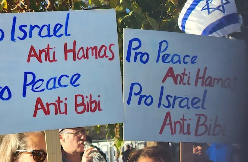  Signs held by members of the "peace bloc" who attended at the March for Israel in Washington, D.C., Nov. 14, 2023. (photo credit: JTA)