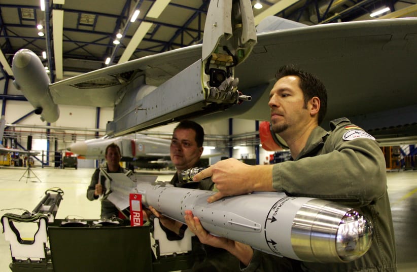  Technical sergeants of the German Air Force attach a new air-to-air missile IRIS-T on a Eurofighter aircraft (photo credit: REUTERS/FABRIZIO BENSCH)