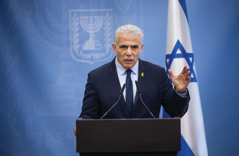  OPPOSITION LEADER Yair Lapid addresses a meeting of his Yesh Atid party’s Knesset faction on Monday. (photo credit: YONATAN SINDEL/FLASH90)