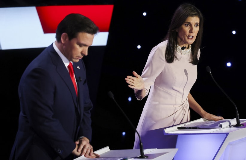 Florida Governor Ron DeSantis and Former U.S. Ambassador to the United Nations Nikki Haley participate in the Republican presidential debate hosted by CNN at Drake University in Des Moines, Iowa, U.S. January 10, 2024. (photo credit: REUTERS/MIKE SEGAR)