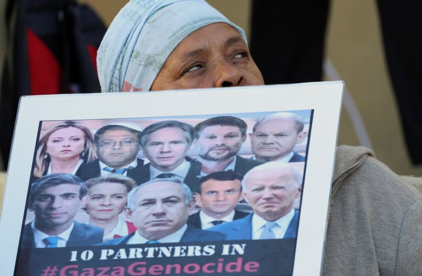 A woman holds a placard during an interfaith prayer service in Bo-Kaap for the success of the South African Government's genocide case, which accuses Israel of genocide in the Gaza war, at the International Court of Justice in the Hague, in Cape Town, South Africa, January 10, 2024 (photo credit: REUTERS/ESA ALEXANDER)
