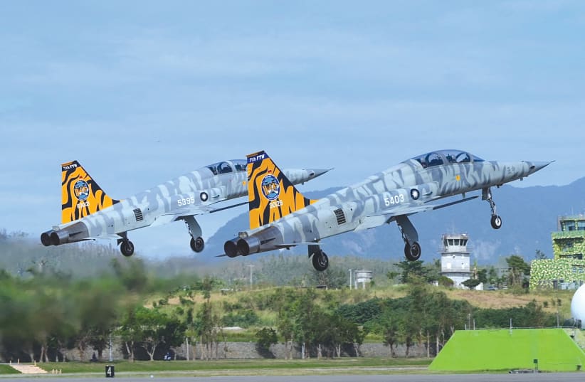  A PAIR of US-made Taiwanese Air Force F-5Fs take off during a demonstration in Taitung, southeast of Taiwan, in November.  (photo credit: Sam Yeh/AFP via Getty Images)