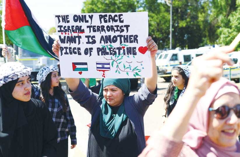  SUPPORTERS OF South Africa’s ruling African National Congress and other political parties, as well as civil society groups, protest outside the Israel Embassy in Pretoria, in October, after the outbreak of the Gaza war. (photo credit: SIPHIWE SIBEKO/REUTERS)