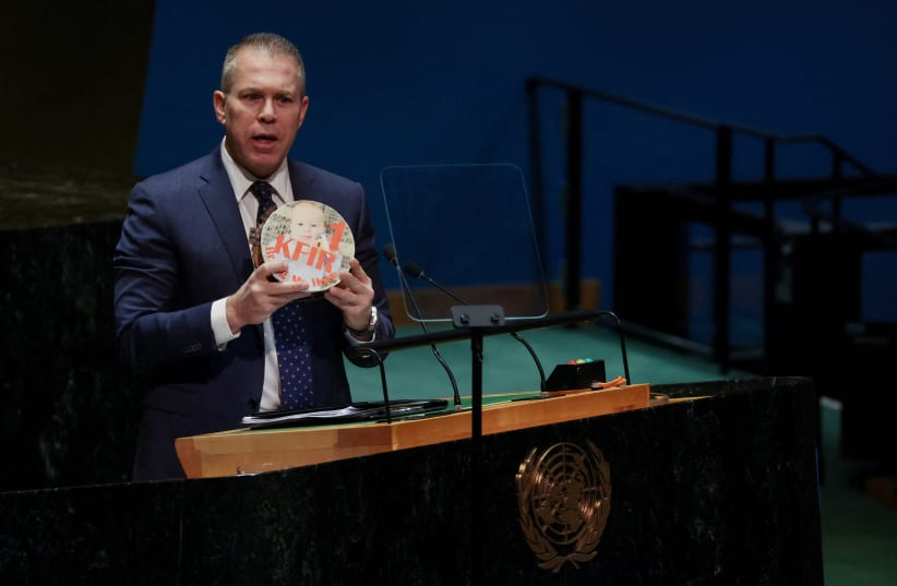  Israeli ambassador to the U.N. Gilad Erdan holds the picture of a child, who he says was kidnapped in the October 7 attack by Hamas, on a birthday cake during a plenary meeting on the 'Use of the veto - Item 63: Special report of the Security Council', in the General Assembly Hall at UN headquarter (photo credit: REUTERS/SHANNON STAPLETON)