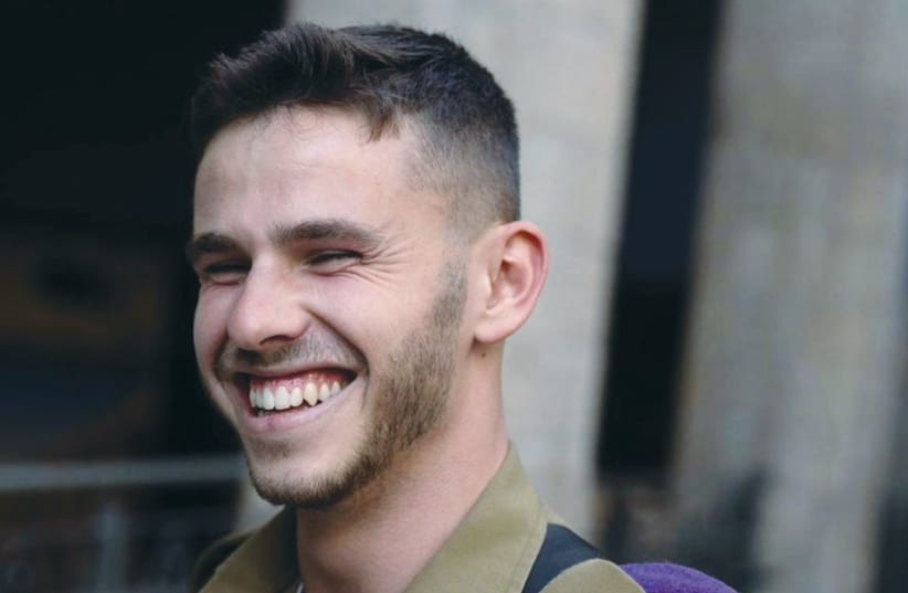  HAREL SMILES broadly as he becomes an officer in the IDF. (photo credit: Ittah family)