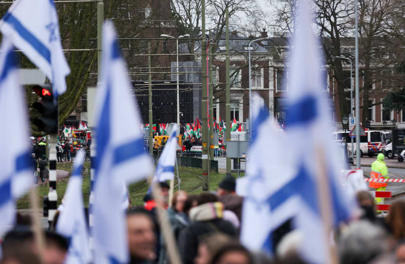  Pro-Israeli and pro-Palestinian protesters gather near the International Court of Justice (ICJ) as judges hear a request for emergency measures by South Africa to order Israel to stop its military actions in Gaza, in The Hague, Netherlands January 12, 2024. (photo credit: REUTERS/THILO SCHMUELGEN)