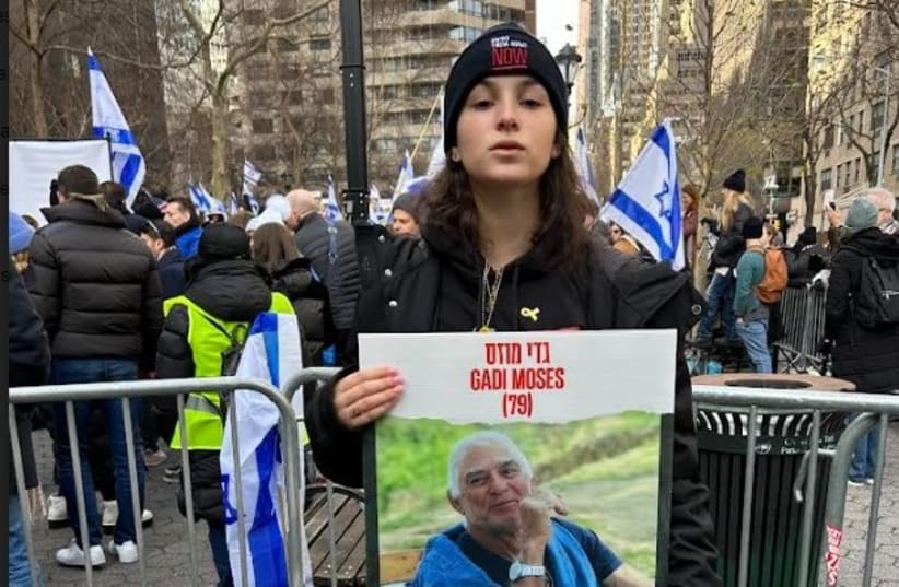  Shani Moses in New York with a poster of her grandfather, Gadi Moses, who was kidnapped by Hamas on October 7. January 12, 2024. (photo credit: HANNAH SARISOHN)