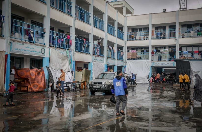  Palestinian at an UNRWA camp in Rafah after heavy rainfall, in the southern Gaza Strip, on November 14, 2023. (photo credit: ABED RAHIM KHATIB/FLASH90)