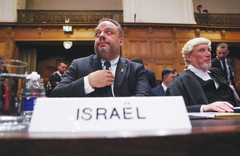 ISRAEL FOREIGN MINISTRY legal adviser Tal Becker and British barrister Malcolm Shaw KC, who appeared on behalf of Israel, attend the International Court of Justice hearing, in The Hague on Friday. (photo credit: THILO SCHMUELGEN/REUTERS)