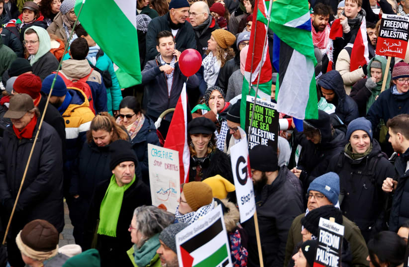  People take part in a protest to mark 100 days since the start of a conflict between Israel and the Palestinian Islamist group Hamas during a "Ceasefire Now/Stop the War in Gaza" protest in London, Britain, January 13, 2024.  (photo credit:  REUTERS/Toby Melville)