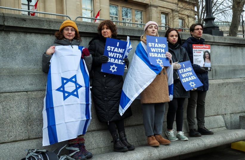  People attend the 'We Stand With Israel' rally to express solidarity with the country on the 100 day anniversary since the October 7 attack by Palestinian Islamist group Hamas, amid the ongoing conflict between Israel and Hamas, in Trafalgar Square in London, Britain, January 14, 2024  (photo credit: REUTERS/Belinda Jiao)