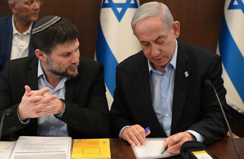  Finance Minister Bezalel Smotrich and Prime Minister Benjamin Netanyahu at the cabinet meeting. January 15, 2024.   (photo credit: HAIM ZACH/GPO)