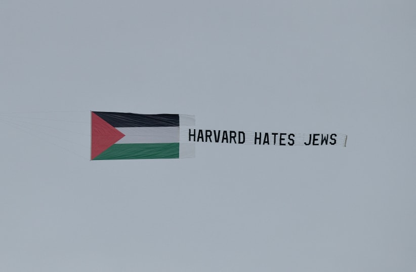  STUDENTS FLY an aerial banner that reads ‘Harvard hates Jews,’ over Harvard University, last month.  (photo credit: Faith Ninivaggi/Reuters)
