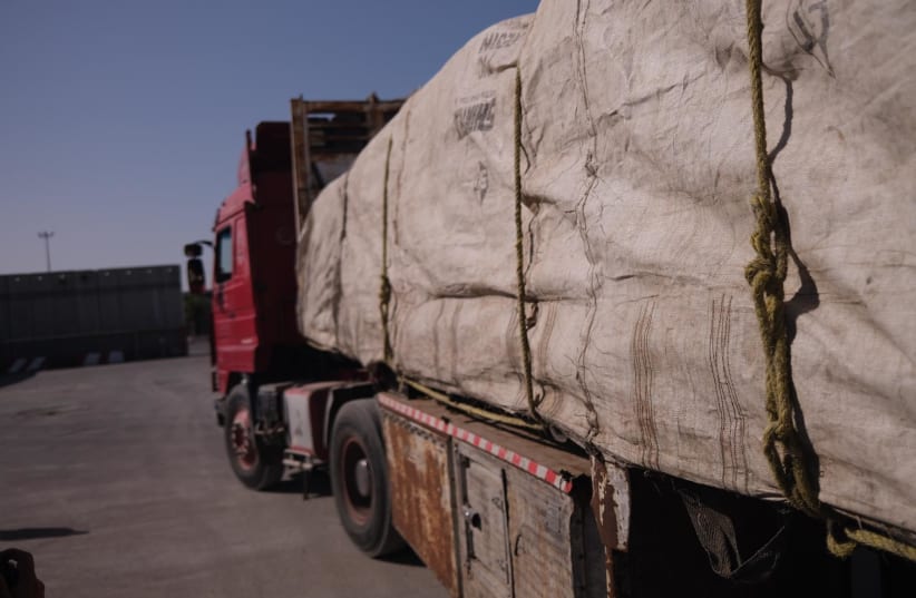  A truck carrying humanitarian aid into Gaza at the Kerem Shalom border crossing, January 2024.  (photo credit: Courtesy of Hananya Naftali )